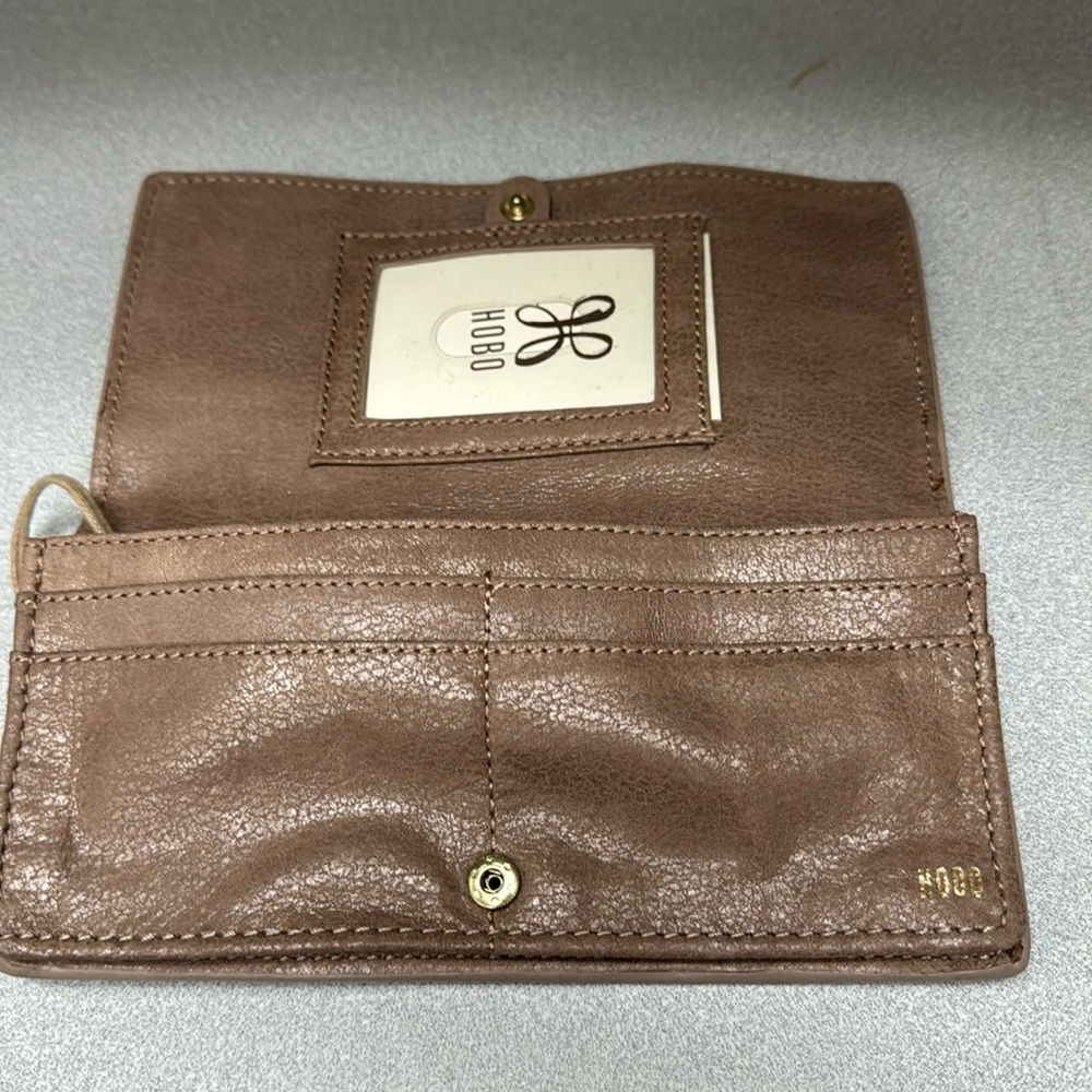 Taupe pebble leather rectangular Hobo wallet.